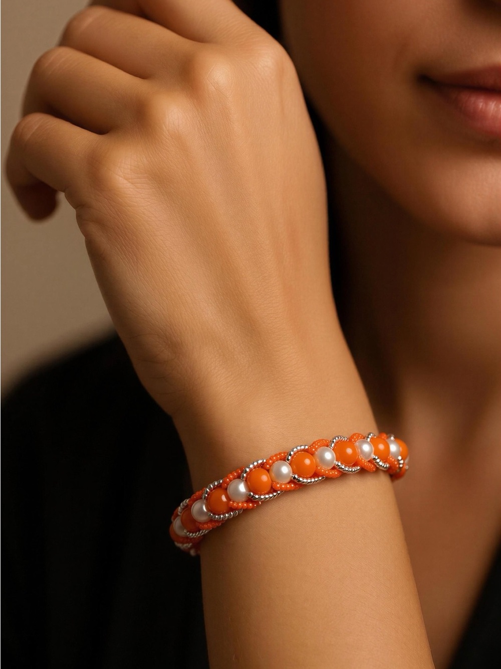 Elegant Orange and White Beaded Bracelet with Silver Accents